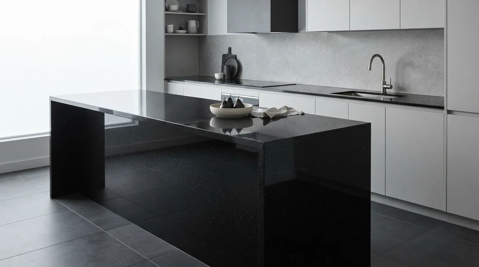 Contemporary kitchen island with a mirror-polished Absolute Black granite countertop and waterfall edge