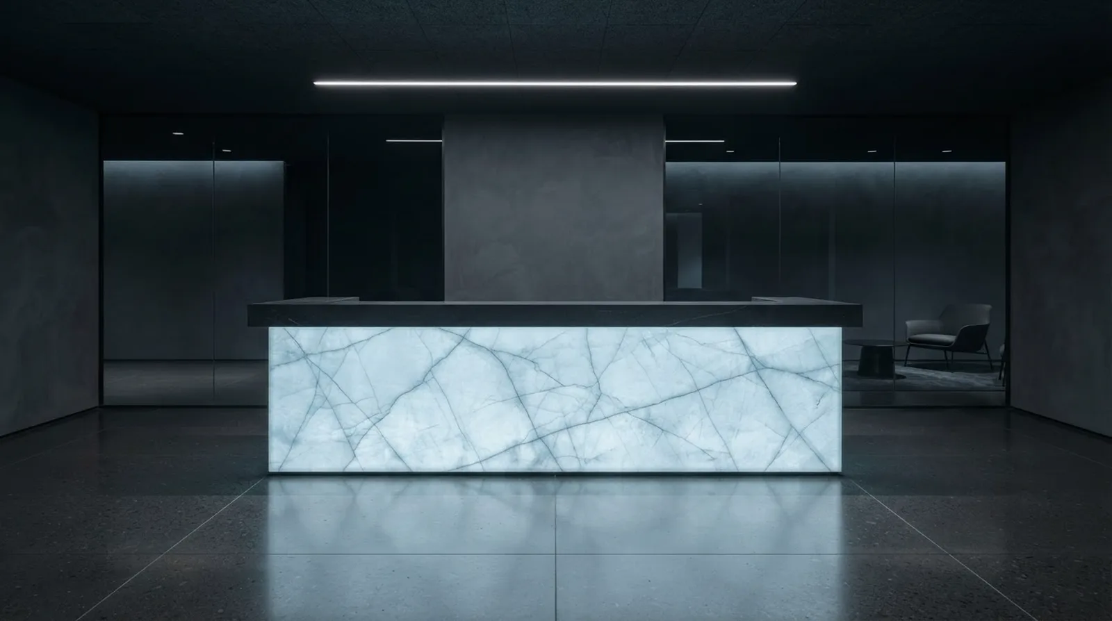 Backlit Cristallo quartzite reception desk glowing pale ice blue in a dark corporate lobby