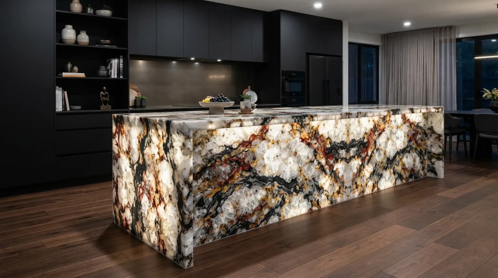 Kitchen island clad in Patagonia quartzite with quartz crystal clusters and garnet and charcoal mineral swirls